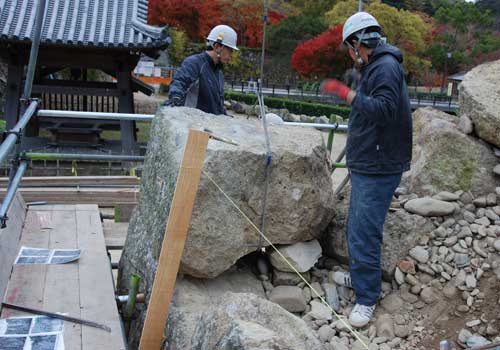 Laying stones in a wall