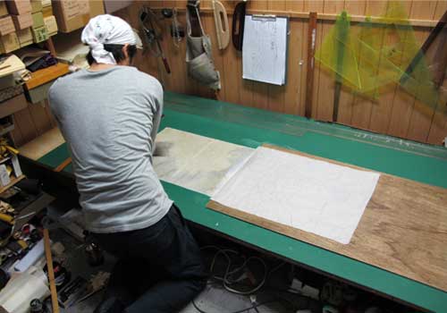 Pressing out the air bubbles on a hanging scroll print